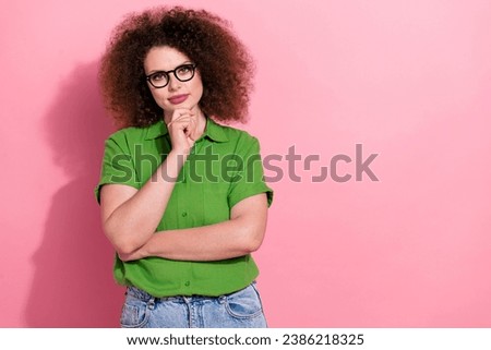 Photo portrait of attractive young woman touch chin minded dressed stylish green clothes isolated on pink color background