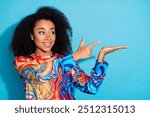 Photo portrait of beautiful curly hair woman in trendy pullover demonstrate her hand nothing interesting isolated on blue color background