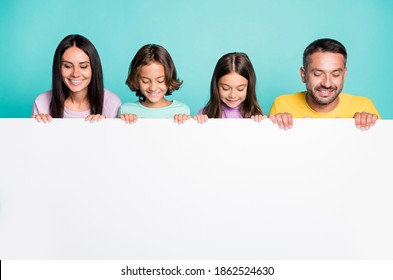 Photo portrait of big family with little kids holding big white paper sheet with copyspace isolated on vivid teal colored background - Shutterstock ID 1862524630