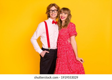 Photo portrait of charming couple smiling embracing on valentines day isolated on bright yellow background