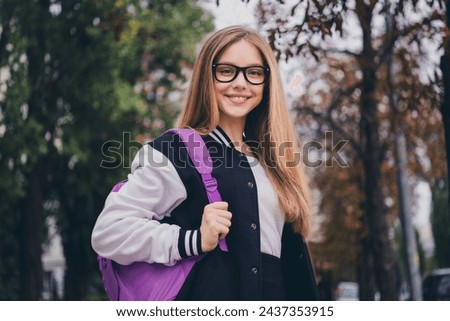 Photo portrait of charming teen woman confident schoolgirl specs sales dressed stylish uniform clothes nature green park background
