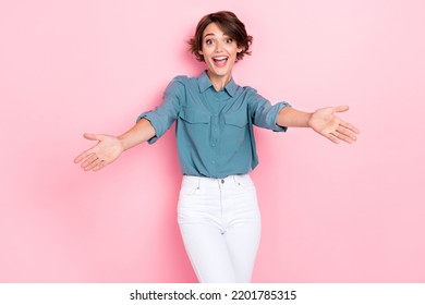 Photo portrait of charming young woman stretch arms excited want hug old friend wear stylish blue outfit isolated on pink color background - Shutterstock ID 2201785315