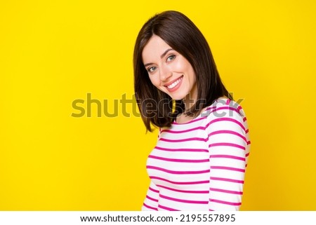 Photo portrait of cheerful young girl toothy beaming smile perfect teeth wear trendy striped clothes isolated on yellow color background