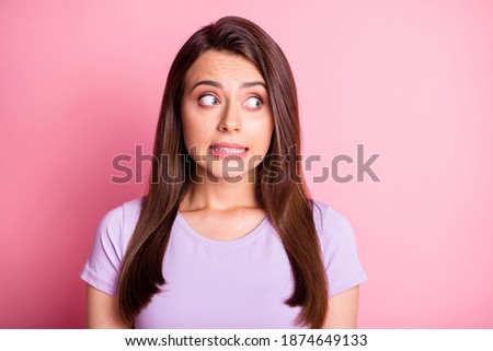 Photo portrait of clumsy girl isolated on pastel pink colored background