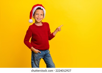 Photo portrait of cute little boy point copyspace christmas north pole wear trendy red knitwear look isolated on yellow color background - Powered by Shutterstock