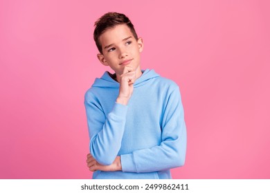 Photo portrait of cute teen boy minded look empty space dressed stylish blue clothes isolated on pink color background - Powered by Shutterstock