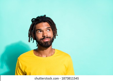 Photo Portrait Of Dreamy Black Skin Man Looking At Blank Space Isolated On Vivid Cyan Colored Background