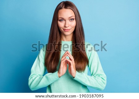 Photo portrait of evil genius woman scheming with fingers touching isolated on pastel blue colored background