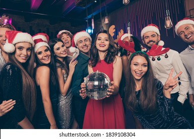 Photo Portrait Of Excited People Together Holding Disco Ball Wearing Goofy Christmas Headwear Welcoming New Year