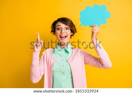 Photo portrait of female student having new idea solution in glasses keeping cloud copyspace isolated on bright yellow color background
