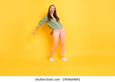 Photo Portrait Full Body View Of Girl Doing Modern Dance Flossing Isolated On Vivid Yellow Colored Background