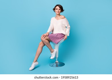 Photo Portrait Full Body View Of Gorgeous Woman Sitting On Bar Stool Isolated On Pastel Blue Colored Background