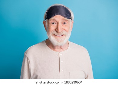 Photo Portrait Of Funny Old Man Smiling In Sleepwear Eye Mask Isolated On Pastel Blue Colored Background