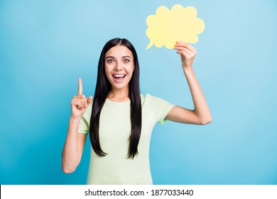 Photo portrait of girl having eureka moment raising finger up holding yellow thought bubble card isolated on pastel blue colored background - Shutterstock ID 1877033440
