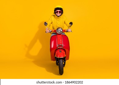 Photo Portrait Of Girl Riding Red Retro Bike Isolated On Vivid Yellow Colored Background