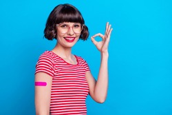 Photo Portrait Girl Smiling With Patch Did Vaccine Showing Okay Sign Isolated Vibrant Blue Color Background