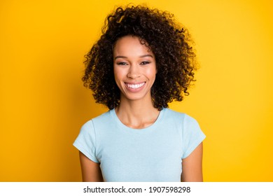 Photo Portrait Of Gorgeous Afro American Curly Girl Smiling Isolated On Vivid Yellow Colored Background