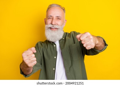 Photo portrait of grandfather imagine driving a car isolated vibrant yellow color background