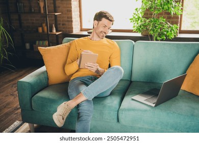 Photo portrait of handsome mature man sit couch online study write notebook dressed yellow outfit cozy day light home interior living room