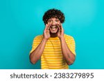 Photo portrait of handsome young guy cover mouth announce scream wear trendy striped yellow outfit isolated on aquamarine color background