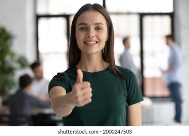 Photo Portrait Of Happy Hired Employee Recommending Internship Program, Showing Thumb Up Approval Hand Gesture At Camera. Client Or Customer Giving Appreciation To Best Company Service