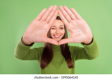 Photo portrait happy woman showing border triangle with palms isolated pastel green color background - Shutterstock ID 1995064145