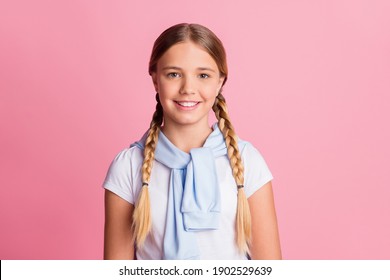 Photo portrait little schoolgirl wearing braids white t-shirt smiling isolated on pastel pink color background - Powered by Shutterstock