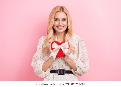 Photo portrait of lovely blonde woman hold red heart box shape present wear trendy white garment isolated on pink color background - Powered by Shutterstock