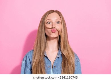 Photo portrait of lovely teen young lady fake mustache strand hair dressed stylish denim garment isolated on pink color background - Shutterstock ID 2341180745