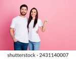 Photo portrait of lovely young couple hugging point empty space wear trendy white garment isolated on pink color background