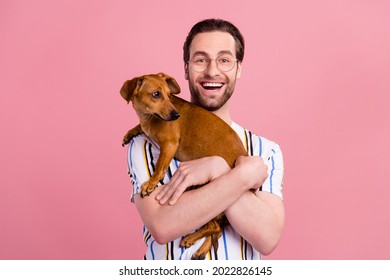 Photo Portrait Man In T-shirt Glasses Laughing Keeping Little Dog Isolated Pastel Pink Color Background