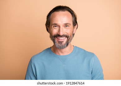 Photo Portrait Of Mature Man Smiling Isolated On Pastel Beige Colored Background