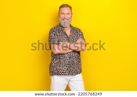 Photo portrait of nice grandparent crossed hands summer outfit dressed stylish leopard print garment isolated on yellow color background