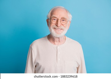 Photo Portrait Of Old Man In Glasses Smiling Isolated On Pastel Blue Colored Background