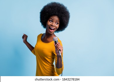 Photo Portrait Of Pretty Black Skinned Girl Singing On Microphone With Wire On Stage Isolated On Vibrant Blue Color Background