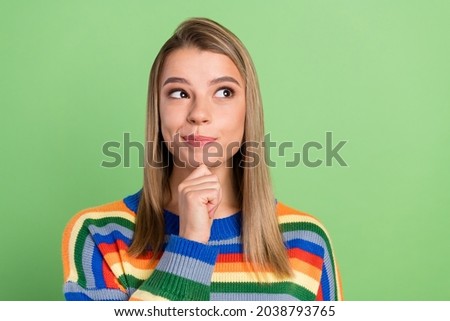 Photo portrait pretty girl got doubt looking blank space thoughtful isolated pastel green color background
