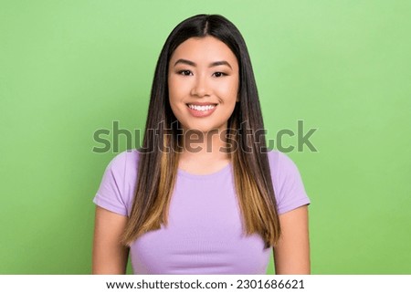 Photo portrait of pretty japanese korean young girl toothy beaming smile wear trendy purple outfit isolated on green color background