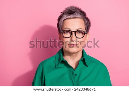 Photo portrait of pretty retired female look camera specs shopping promo wear trendy green outfit isolated on pink color background