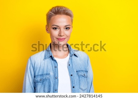 Photo portrait of pretty young girl look camera shopping promo dressed stylish denim outfit isolated on yellow color background