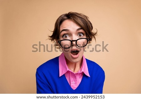 Photo portrait of pretty young girl open mouth amazed reaction wear trendy blue outfit isolated on beige color background