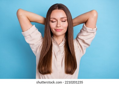 Photo Portrait Of Pretty Young Lady Closed Eyes Hands Behind Head Take Nap Wear Stylish Smart Casual Look Isolated On Blue Color Background