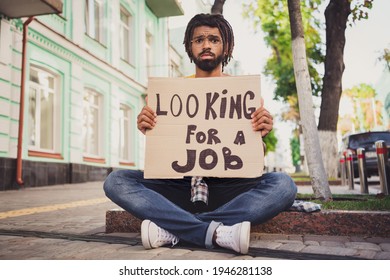 Photo Portrait Of Sad Grumpy Man Holding Carton Table Looking For Job Need New Work Money Sitting On Ground