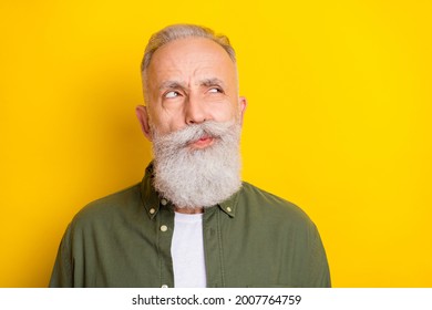 Photo Portrait Of Senior Man Doubtful Unsure Looking Copyspace Isolated On Bright Yellow Color Background