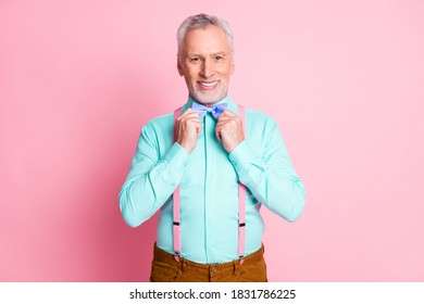 Photo Portrait Of Senior Man Preparing For Party Dressing Up Blue Bowtie Teal Shirt Suspenders Smiling Isolated On Pink Color Background