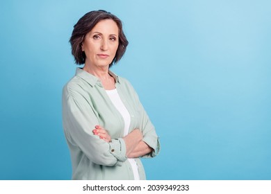 Photo portrait senior woman in shirt with crossed hands isolated pastel blue color background copyspace - Shutterstock ID 2039349233