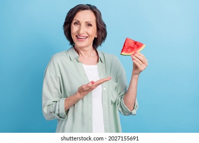 Photo portrait senior woman showing hands watermelon isolated pastel blue color background - Powered by Shutterstock