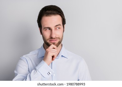 Photo portrait serious touching chin businessman wearing formalwear looking copyspace isolated grey color background - Shutterstock ID 1980788993