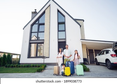 Photo Portrait Of Smiling Big Full Family With Small Kids Keeping Baggage Near Car Relocating Ready To Enter Home Apartment