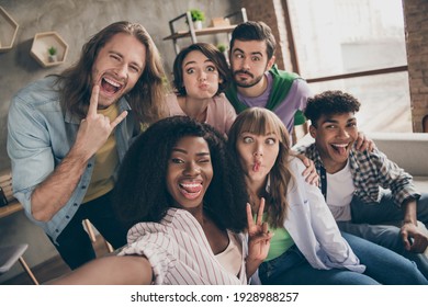 Photo portrait of smiling friends showing v-sign heavy metal gestures taking selfie grimacing silly faces - Powered by Shutterstock