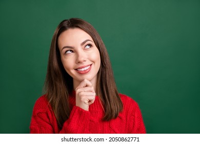 Photo portrait smiling girl wearing knitted sweater looking blank space dreamy isolated green color background